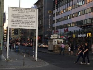 Checkpoint Charlie--a large sign post announces entry into the American Zone