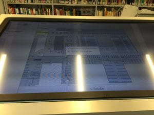 A touch-screen computer showing an interactive map of the library