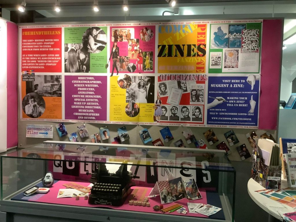 LGBTQ+ History Month display boards and zine information